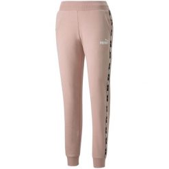 Spodnie damskie Puma Power Tape FL. Czerwone spodnie dresowe damskie Puma, bez wzorów, sportowe. Za 148.99 zł.