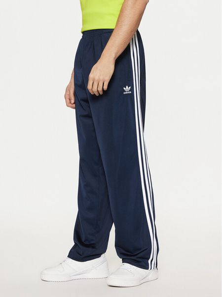 Adidas Spodnie dresowe adicolor Classics Firebird IM9471 Granatowy Regular Fit. Niebieskie spodnie dresowe męskie Adidas, bez wzorów, z dresówki. Za 189.99 zł.