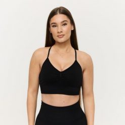 Biustonosz sportowy damski bezszwowy czarny Sculpt. Czarne biustonosze sportowe damskie GYMBEAM, bez wzorów, z elastanu. Za 97.90 zł.
