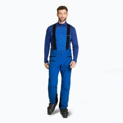 Spodnie narciarskie męskie ZIENER Tronador. Niebieskie spodnie materiałowe męskie Ziener, bez wzorów, z materiału, sportowe. Za 789.99 zł.