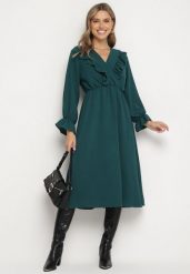 Ciemnozielona Rozkloszowana Sukienka z Gumką w Talii z Kopertowym Dekoltem i Falbanką Florisse. Zielone sukienki damskie Born2be, na co dzień, na lato, bez wzorów, eleganckie, bez kołnierzyka, bez ramiączek, midi, kopertowe. W wyprzedaży za 63.99 zł.