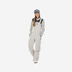 Spodnie snowboardowe ogrodniczki damskie Dreamscape SNB BIB 900. Brązowe spodnie dresowe damskie DREAMSCAPE, bez wzorów, z materiału, sportowe. Za 759.99 zł.