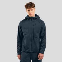 Kurtka Odlo ZEROWEIGHT WINDPROOF X WARM Jacket. Niebieskie kurtki męskie Odlo, bez wzorów, bez kaptura, narciarskie. Za 899.99 zł.