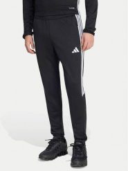 Adidas Spodnie dresowe Tiro 25 Essentials Training KG0809 Czarny Regular Fit. Czarne spodnie dresowe męskie Adidas, bez wzorów, z dresówki. Za 199.99 zł.