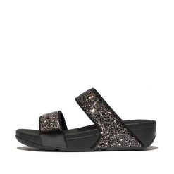 Sandały na koturnie z cekinami damskie FitFlop Lulu. Czarne sandały damskie FIT FLOP, bez wzorów, z materiału, bez obcasa, na koturnie. Za 469.00 zł.