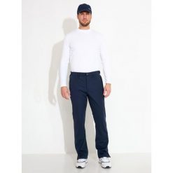 Spodnie przeciwdeszczowe Abacus Bounce. Niebieskie spodnie materiałowe męskie ABACUS, bez wzorów, sportowe. Za 851.25 zł.