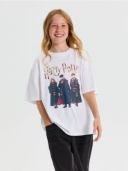 Bawełniana koszulka oversize z nadrukiem Harry Potter - biały. Białe koszulki dziewczęce Sinsay, l, bez wzorów, z bawełny, bez ramiączek. Za 15.99 zł.