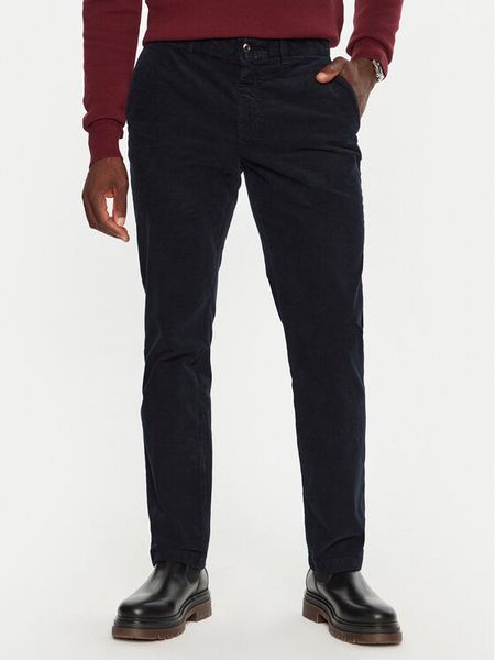 Tommy Hilfiger Spodnie materiałowe MW0MW32932 Granatowy Regular Fit. Niebieskie spodnie materiałowe męskie Tommy Hilfiger, bez wzorów, z materiału. Za 349.99 zł.