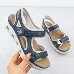 Sandały damskie sportowe na rzep granatowe Rieker 64066-14. Sandały damskie Rieker, bez wzorów, ze skóry ekologicznej, bez obcasa. Za 288.99 zł.