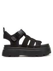 Ugg Sandały W Cora 1152698 Czarny. Czarne sandały damskie Ugg, bez wzorów, z nubiku, bez obcasa, na płaskiej podeszwie. Za 439.99 zł.