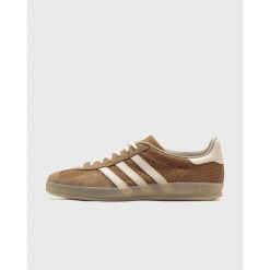 Uniseksowe buty sportowe ADIDAS GAZELLE INDOOR. Brązowe buty trekkingowe męskie Adidas. Za 731.55 zł.