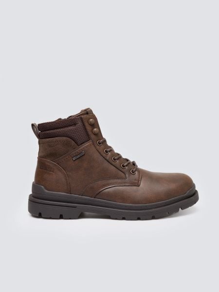 Trapery męskie ze skóry naturalnej brązowe SS174124 803. Brązowe buty zimowe męskie Big Star, z materiału, z okrągłym noskiem, bez zapięcia. Za 349.99 zł.