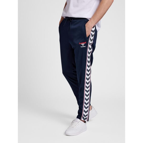 Spodnie dresowe slim fit Hummel IC Lerby. Niebieskie spodnie sportowe damskie HUMMEL, bez wzorów, z dresówki, sportowe. Za 312.50 zł.