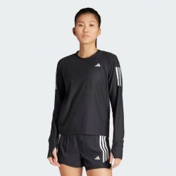 Koszulka Own The Run Long Sleeve. Czarne koszulki męskie z długim rękawem Adidas, s, z materiału. Za 199.00 zł.