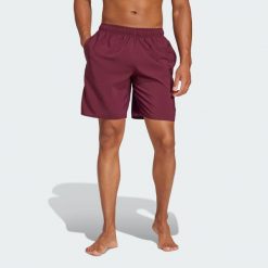 Szorty do pływania Solid CLX Classic-Length. Czarne szorty męskie Adidas, bez wzorów, z materiału, klasyczne. Za 139.00 zł.