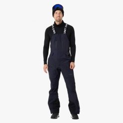 Spodnie narciarskie męskie Swedemount Lofoten 3L Shell Bib Pants II wodoodporne. Niebieskie spodnie materiałowe męskie SWEDEMOUNT, bez wzorów, sportowe. W wyprzedaży za 672.00 zł.