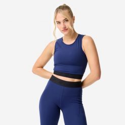Koszulka fitness damska Domyos crop top. Niebieskie topy sportowe damskie DOMYOS, l, bez wzorów, z lycry, bez ramiączek. Za 44.99 zł.