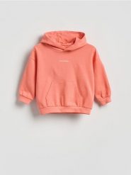 Bawełniana bluza z kapturem - czerwony. Czerwone bluzy i bluzki niemowlęce Reserved, bez wzorów, z bawełny, bez ramiączek, z kapturem. Za 45.99 zł.