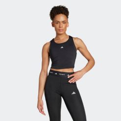 Second Life - Koszulka fitness damska ADIDAS bez rękawów - Stan Doskonały. Bluzki sportowe damskie Adidas, m, z materiału, bez kołnierzyka, bez ramiączek. Za 75.99 zł.