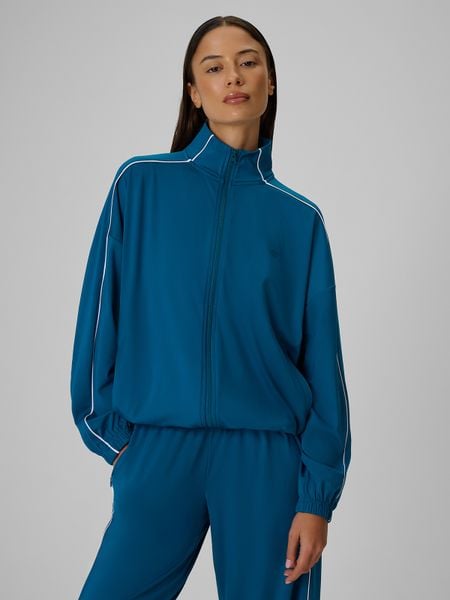 4F Bluza dresowa loose bez kaptura damska - turkusowa M. Niebieskie bluzy bez kaptura damskie 4f, l, z dresówki. Za 179.99 zł.