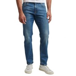 Dżinsy slim fit z bawełny organicznej Superdry. Niebieskie jeansy męskie Superdry. W wyprzedaży za 387.50 zł.