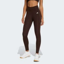 Długie legginsy Optimé Essentials Stash Pocket. Brązowe legginsy damskie Adidas, bez wzorów. Za 231.00 zł.