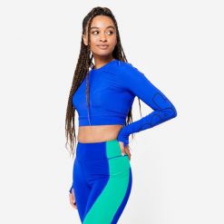 Koszulka fitness damska Domyos crop top długi rękaw. Niebieskie bluzki sportowe damskie DOMYOS, l, bez wzorów, z elastanu, bez ramiączek. Za 89.99 zł.