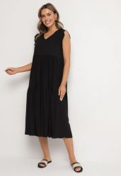 Czarna Bawełniana Sukienka Ozdobiona Falbankami Aveliova. Czarne sukienki damskie Born2be, na co dzień, l, bez wzorów, z bawełny, eleganckie, bez kołnierzyka, bez ramiączek, midi, proste. W wyprzedaży za 47.99 zł.