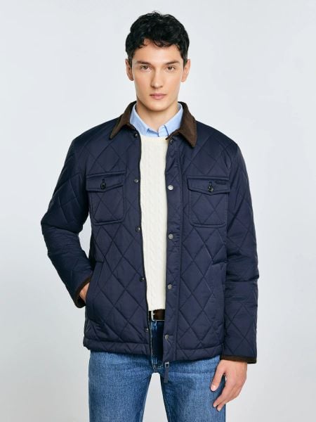 Kurtka męska pikowana ze sztruksowym kołnierzem granatowa Antwan 403. Niebieskie kurtki męskie Big Star, l, bez wzorów, ze sztruksu, eleganckie, bez kaptura. Za 429.99 zł.