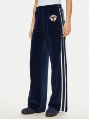 Tommy Jeans Spodnie dresowe Velvet DW0DW20542 Niebieski Regular Fit. Niebieskie jeansy damskie Tommy Jeans, s, bez wzorów, z bawełny. Za 299.99 zł.