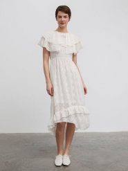 BGN Sukienka w kolorze kremowym rozmiar: 34. Brązowe sukienki damskie BGN, na imprezę, bez wzorów, bez kołnierzyka, bez ramiączek, midi. Za 109.52 zł.