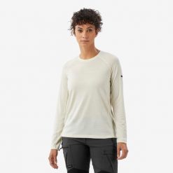 Koszulka trekkingowa damska z długim rękawem Merino Resist undyed. Białe bluzki damskie FORCLAZ, l, bez wzorów, z materiału, sportowe, bez kołnierzyka, bez ramiączek. Za 199.99 zł.