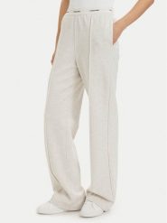 Calvin Klein Jeans Spodnie dresowe LV047G253G Kremowy Relaxed Fit. Białe spodnie dresowe damskie Calvin Klein Jeans, xl, bez wzorów, z bawełny. Za 409.99 zł.