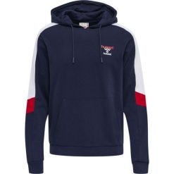 Bluza z kapturem Hummel IC Claude. Niebieskie bluzy sportowe damskie HUMMEL, xl, bez wzorów, bez ramiączek, z kapturem. W wyprzedaży za 163.50 zł.