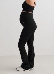 Damskie legginsy ciążowe bezszwowe, w prążki, rozszerzane, wysoki stan czarne. Czarne legginsy damskie Aim'n, s, bez wzorów, z dzianiny. Za 296.00 zł.