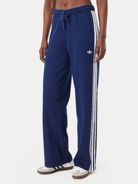 Adidas Spodnie dresowe Firebird KW2605 Niebieski Regular Fit. Niebieskie spodnie dresowe damskie Adidas, m, bez wzorów, z dresówki. Za 349.99 zł.