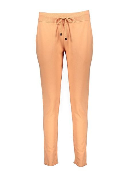 Juvia Spodnie dresowe w kolorze brzoskwiniowym rozmiar: XL. Pomarańczowe spodnie dresowe damskie JUVIA, xl, bez wzorów, z dresówki. Za 179.95 zł.
