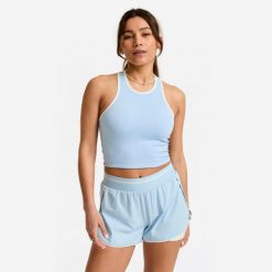 Koszulka fitness damska Domyos bez rękawów. Niebieskie bluzki sportowe damskie DOMYOS, m, z elastanu, bez kołnierzyka, bez ramiączek. Za 49.99 zł.