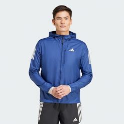 Kurtka Own the Run. Niebieskie kurtki treningowe męskie Adidas, bez wzorów, z materiału, do biegania. Za 379.00 zł.