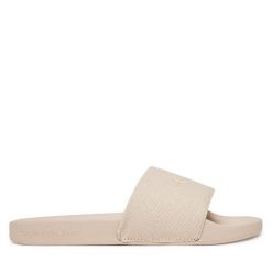 Klapki Calvin Klein Jeans. Brązowe klapki damskie Calvin Klein Jeans, bez wzorów, z jeansu, bez obcasa. Za 109.99 zł.