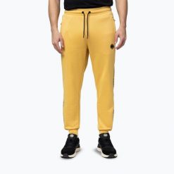 Spodnie męskie Pitbull Trackpants Tape Logo Terry Group. Żółte spodnie sportowe męskie PITBULL. Za 189.99 zł.