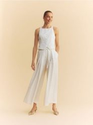 Szerokie spodnie z lyocellem - biały. Białe spodnie materiałowe damskie Reserved, bez wzorów, z lyocellu. Za 149.99 zł.