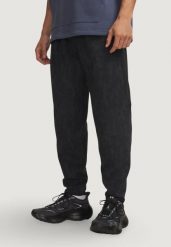 Spodnie Mężczyzna UNDER ARMOUR UA UNSTOPPABLE FLC JOGGERS. Czarne spodnie sportowe męskie Under Armour, z bawełny. Za 603.99 zł.