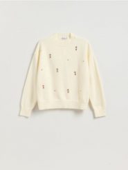 Sweter z ozdobnymi aplikacjami - kremowy. Białe swetry klasyczne damskie Reserved, l, z dzianiny, bez kołnierzyka. Za 139.99 zł.