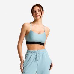 Stanik sportowy. Niebieskie biustonosze sportowe damskie Decathlon, bez wzorów, z elastanu. Za 49.99 zł.