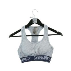 Second life - Top sportowy damski Flex Gymshark szary - Jak nowy. Szare topy sportowe damskie Gymshark, l, bez wzorów, z materiału, bez ramiączek. Za 63.86 zł.
