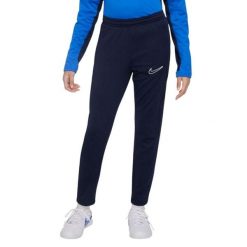 Męskie Spodnie Do Biegania Academy 23 DriFIT. Niebieskie spodnie materiałowe męskie Nike, bez wzorów, z materiału. Za 205.99 zł.
