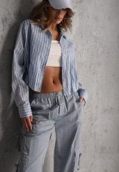 Niebieska Oversizowa Koszula z Bawełny w Pionowe Paseczki z Gumką Kadink. Niebieskie koszule damskie Renee, l, bez wzorów, z bawełny, eleganckie, bez kołnierzyka, bez ramiączek. Za 139.99 zł.