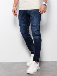 Spodnie męskie marmurkowe JOGGERY z ozdobnymi przeszyciami - granatowe V1. Niebieskie spodnie materiałowe męskie Ombre Clothing, bez wzorów, z bawełny. W wyprzedaży za 69.99 zł.