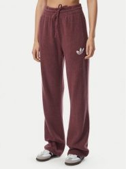 Adidas Spodnie dresowe Essentials IA4436 Bordowy Loose Fit. Czerwone spodnie dresowe damskie Adidas, l, bez wzorów, z dresówki. Za 298.99 zł.